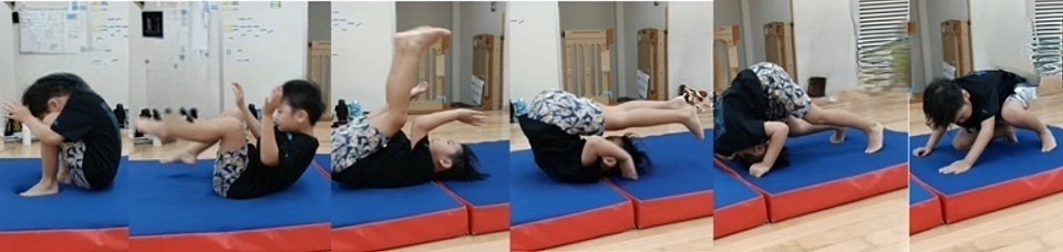 後転、動作中目を閉じてしまう癖、これを修正しようと練習を続けてきた後転、“笹船練習”がバチっとはまりました！笹船とは写真の右から２つ目、「頭の後ろのマットを足で触れる動作」です。覚醒したかのように一気に出来るようになった１年生Y君でした！鈴井